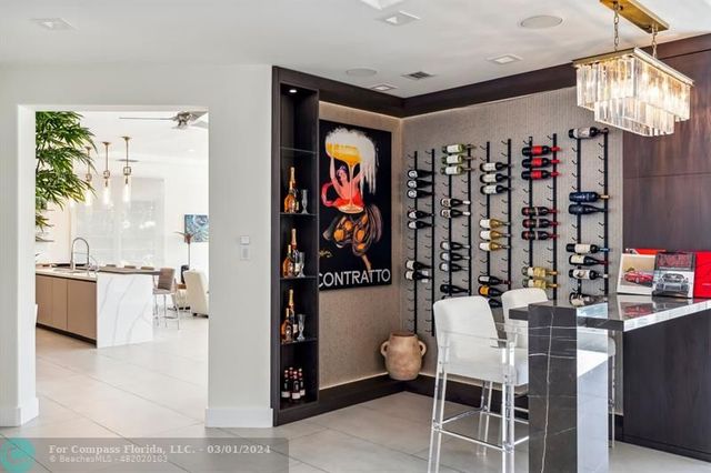a group of people sitting in a kitchen