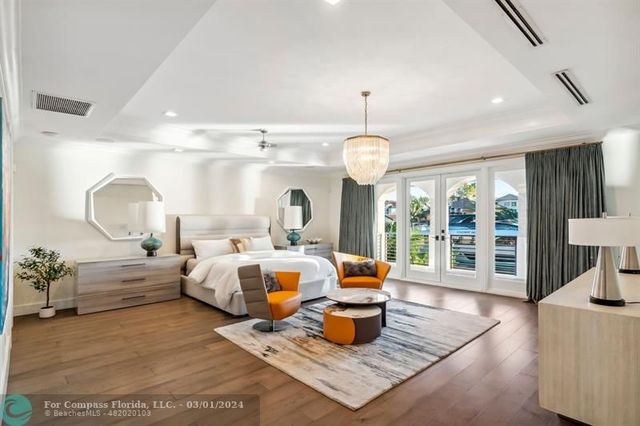 a living room with furniture windows and a table