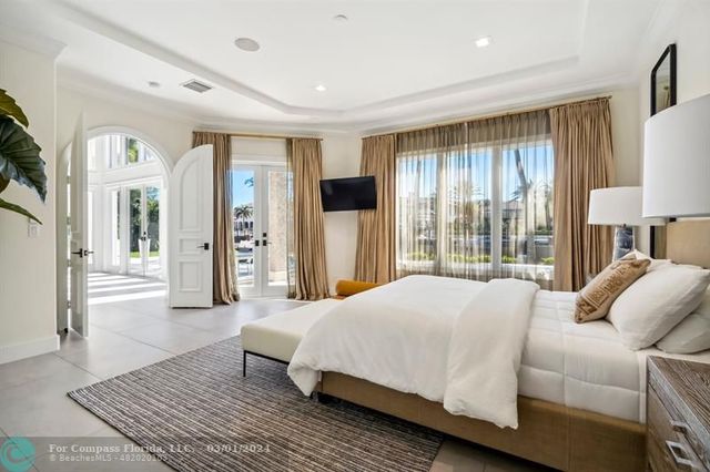 a spacious bedroom with a large bed and a couch