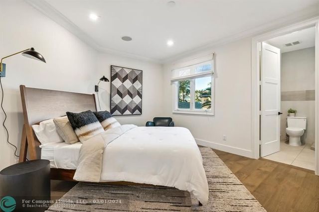 a bedroom with a large bed and a couch