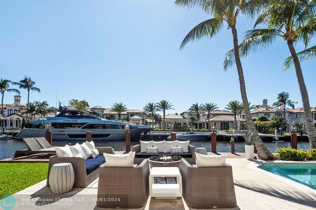 a view of a house with outdoor space and sitting area
