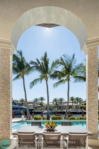 a view of a swimming pool with a table and chairs