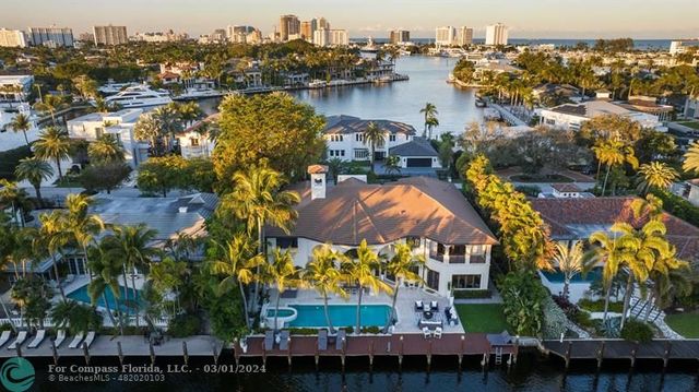 an aerial view of residential houses with city view