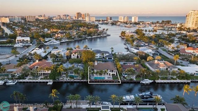 an aerial view of a city with a lake