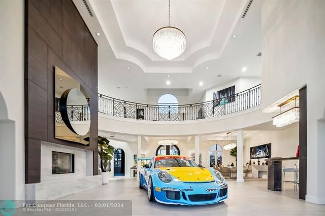 a living room with furniture and a mirror