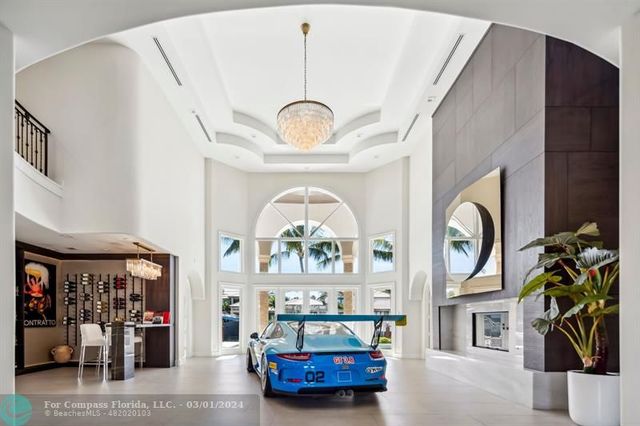 a view of living room with furniture and a fireplace