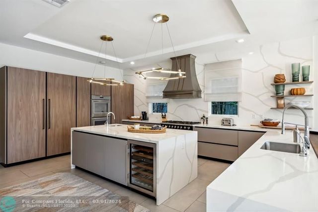 a kitchen with a stove a refrigerator and wooden cabinets