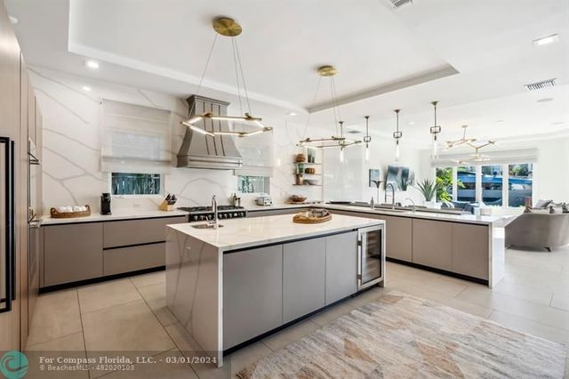 a kitchen with stainless steel appliances granite countertop a stove and a sink