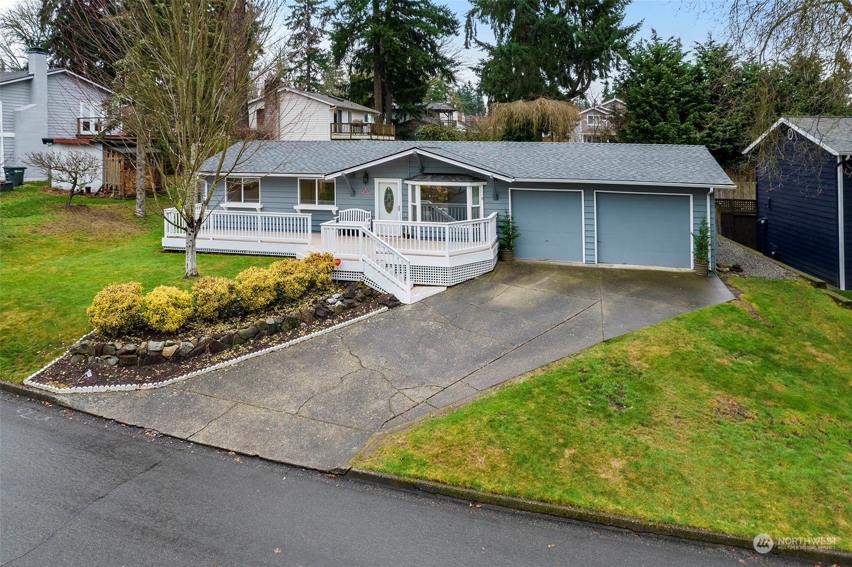 21711 6th Avenue West Bothell, WA 98021 - Photo 1 of 10 a front view of a house with a garden and trees