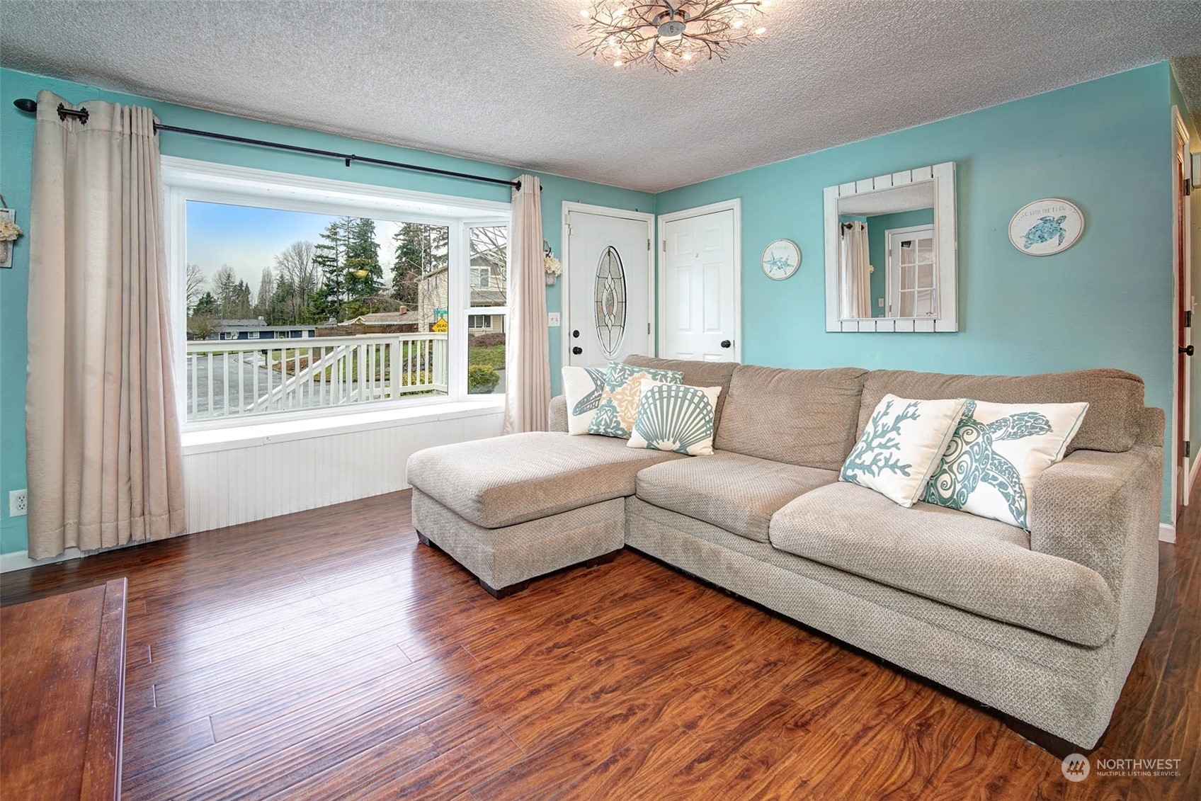 21711 6th Avenue West Bothell, WA 98021 - Photo 3 of 10 a living room with furniture and a large window