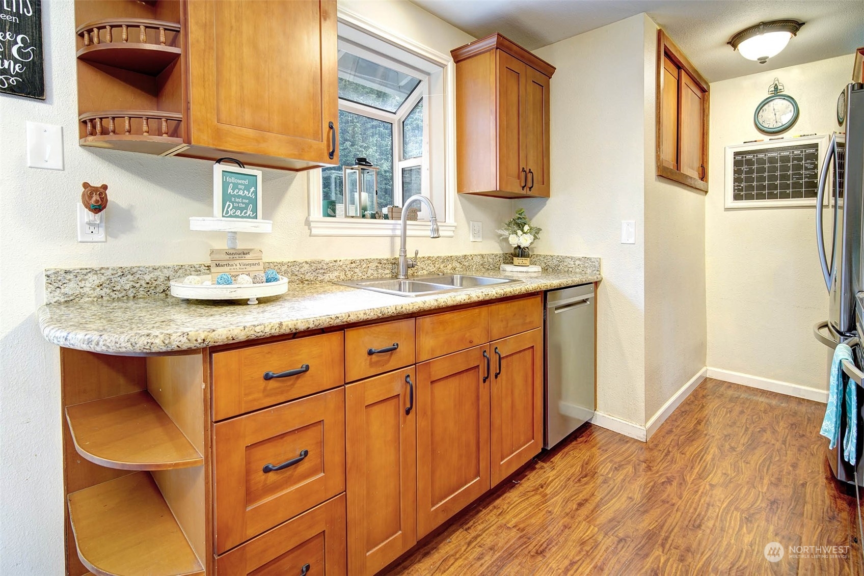 21711 6th Avenue West Bothell, WA 98021 - Photo 5 of 10 a bathroom with a granite countertop sink and a mirror