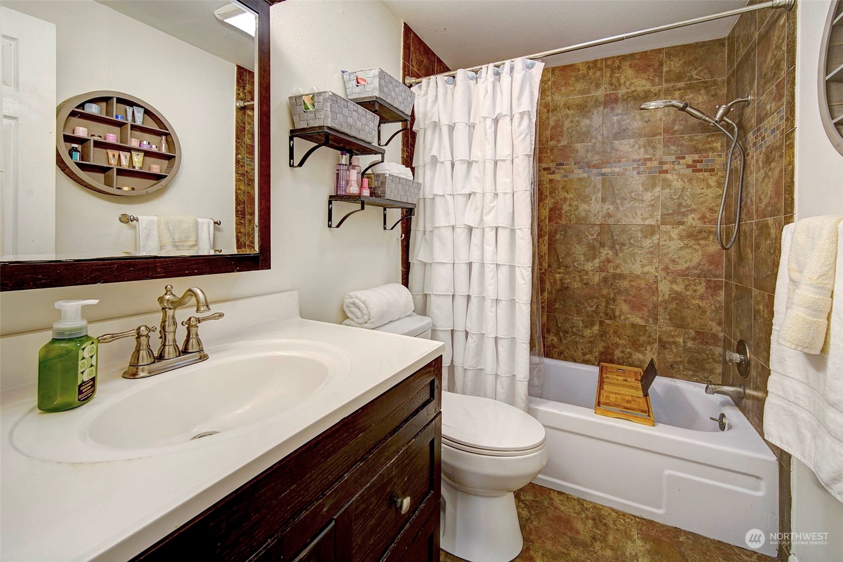 21711 6th Avenue West Bothell, WA 98021 - Photo 6 of 10 a bathroom with a sink a toilet and shower