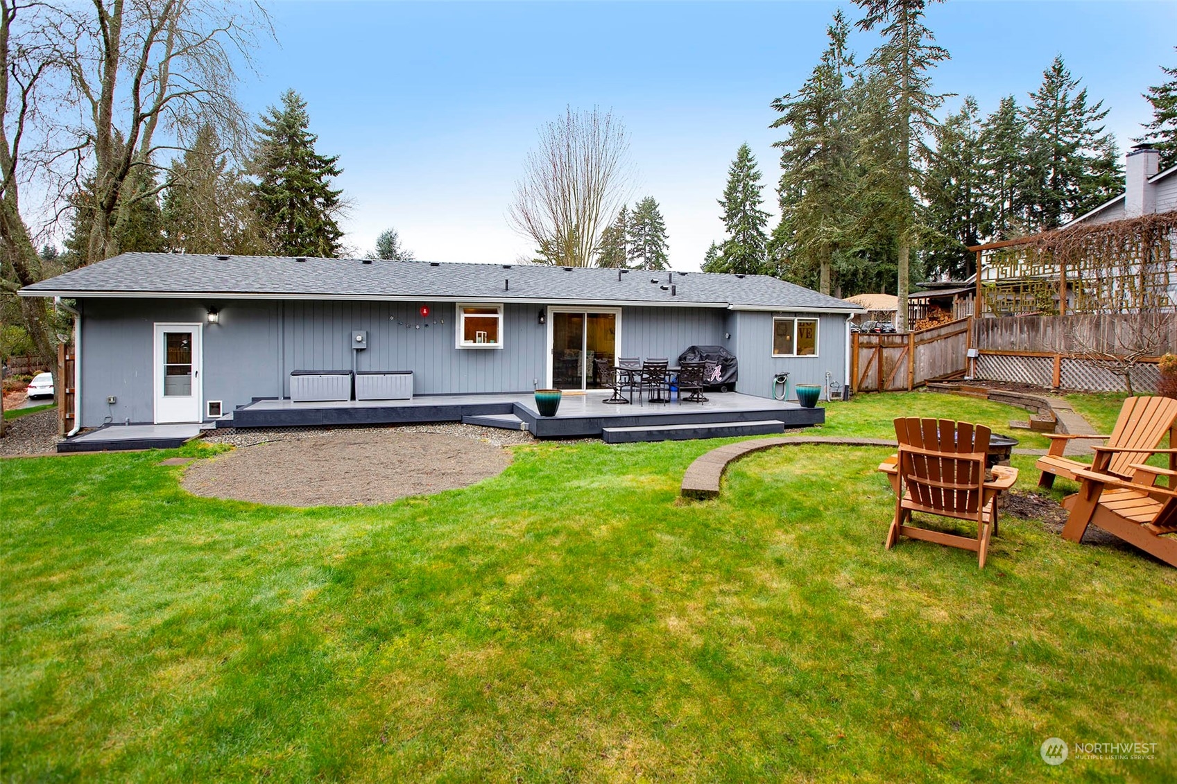 21711 6th Avenue West Bothell, WA 98021 - Photo 9 of 10 a view of a swimming pool with couches chairs and wooden fence