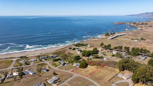 an aerial view of beach and ocean