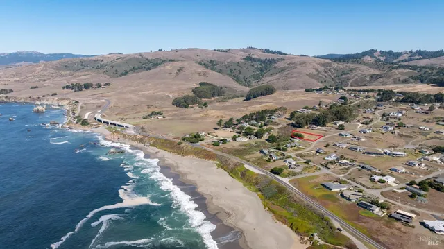 an aerial view of house with yard