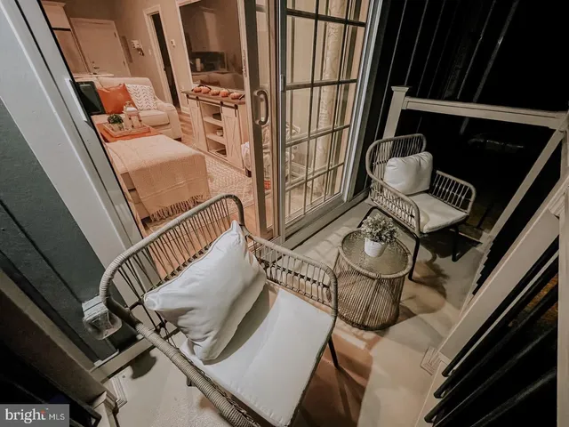 a view of living room with furniture and fireplace