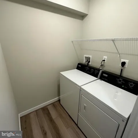 a front view of a house with yard and green space