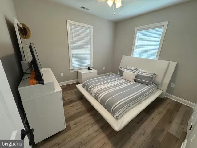 a bedroom with a bed and a couch