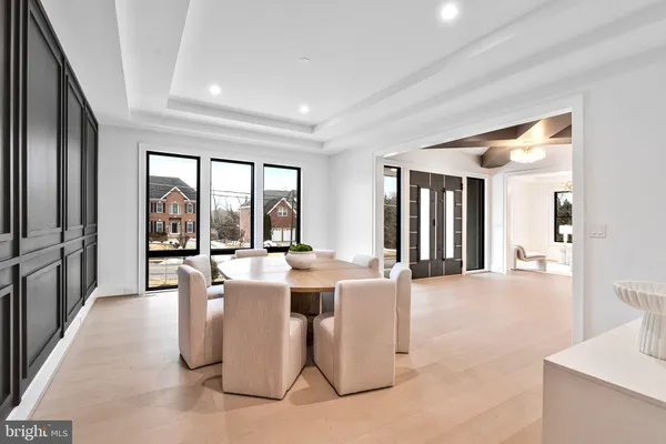 a large kitchen with a table and chairs