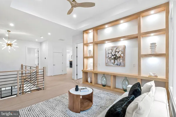 a view of empty room with wooden floor and fireplace