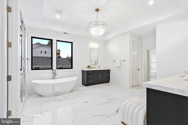 a view of an empty room with window wooden floor and a fireplace