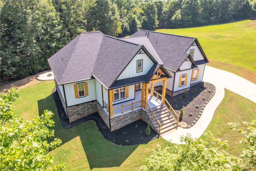 574 Paramount Drive Seneca, SC 29678 - Photo 44 of 45 An inviting front porch welcomes you to this modern farmhouse with a beautifully landscaped yard.