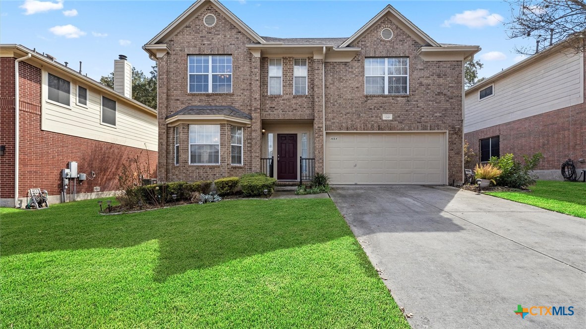4664 Summit Hill Drive Schertz, TX 78154 - Photo 1 of 1 a front view of a house with a garden and plants