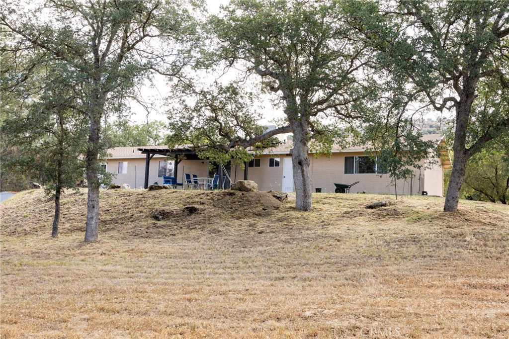 30142 Revis Road Coarsegold, CA 93614 - Photo 34 of 43 a big house with trees in front of it