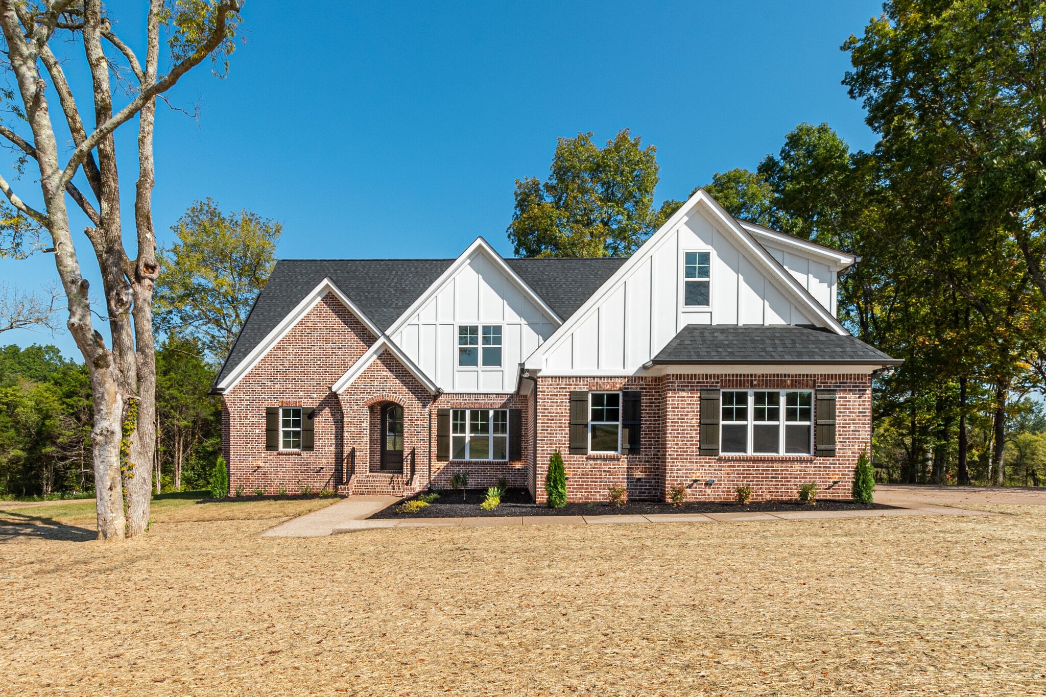 front view of a house with a yard
