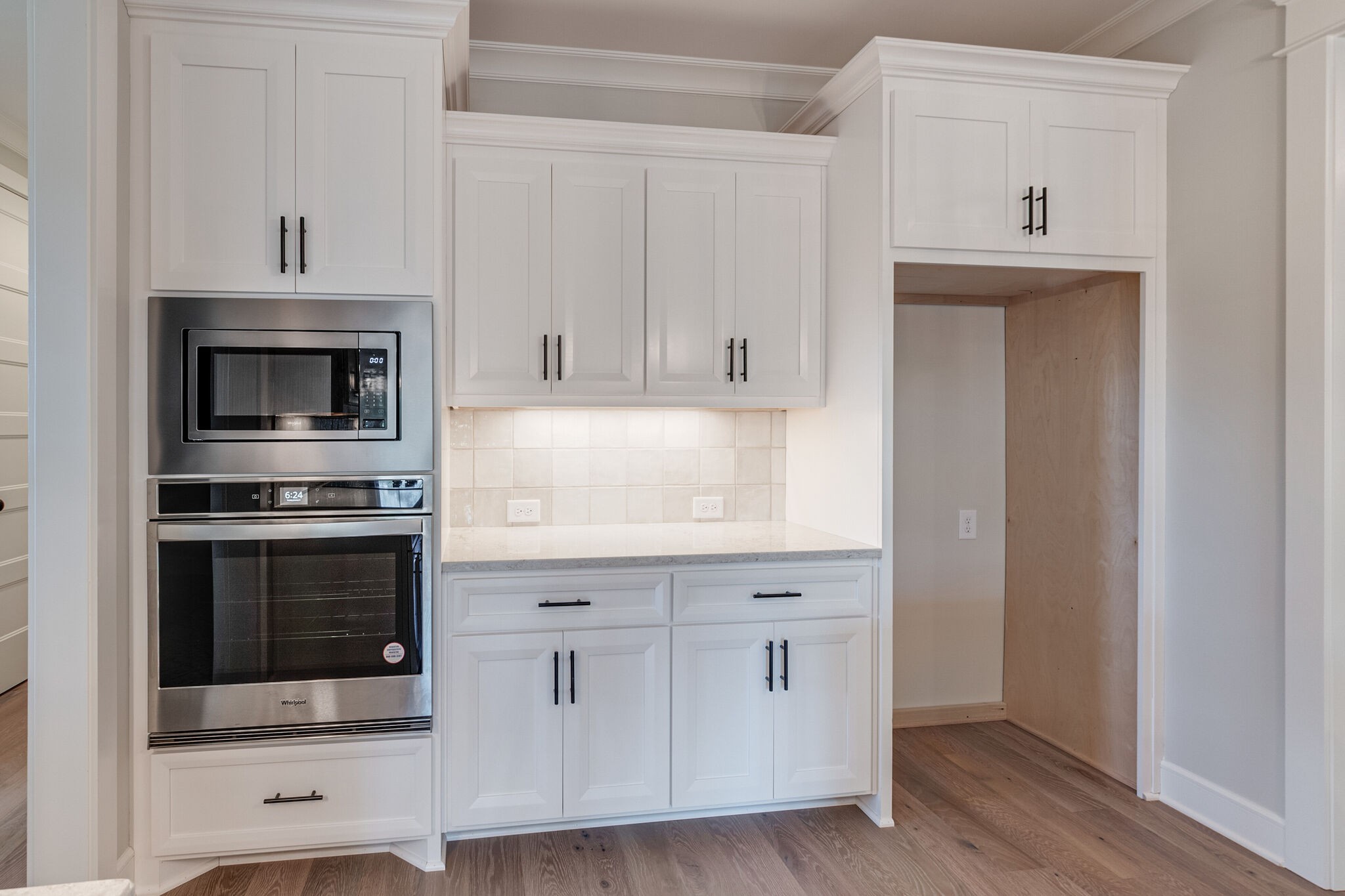 1497 Phillips Road Lebanon, TN 37087 - Photo 16 of 43 a kitchen with white cabinets and stainless steel appliances
