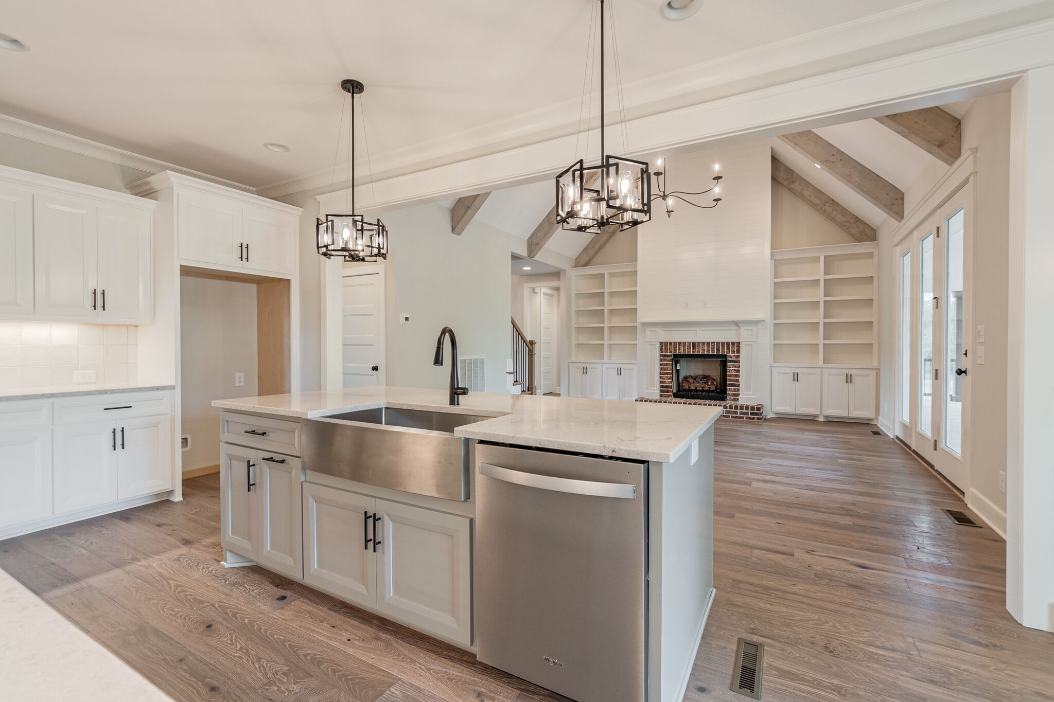 1497 Phillips Road Lebanon, TN 37087 - Photo 17 of 43 a kitchen with stainless steel appliances granite countertop a stove oven and a wooden floor