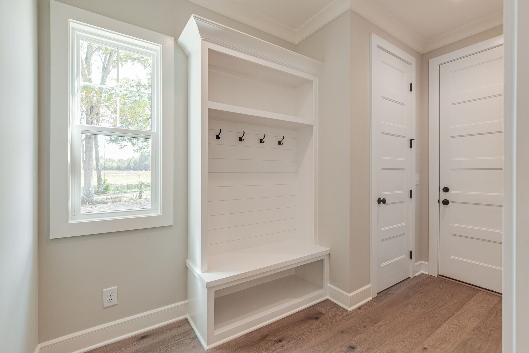 1497 Phillips Road Lebanon, TN 37087 - Photo 20 of 43 a view of an empty room with window and wooden floor