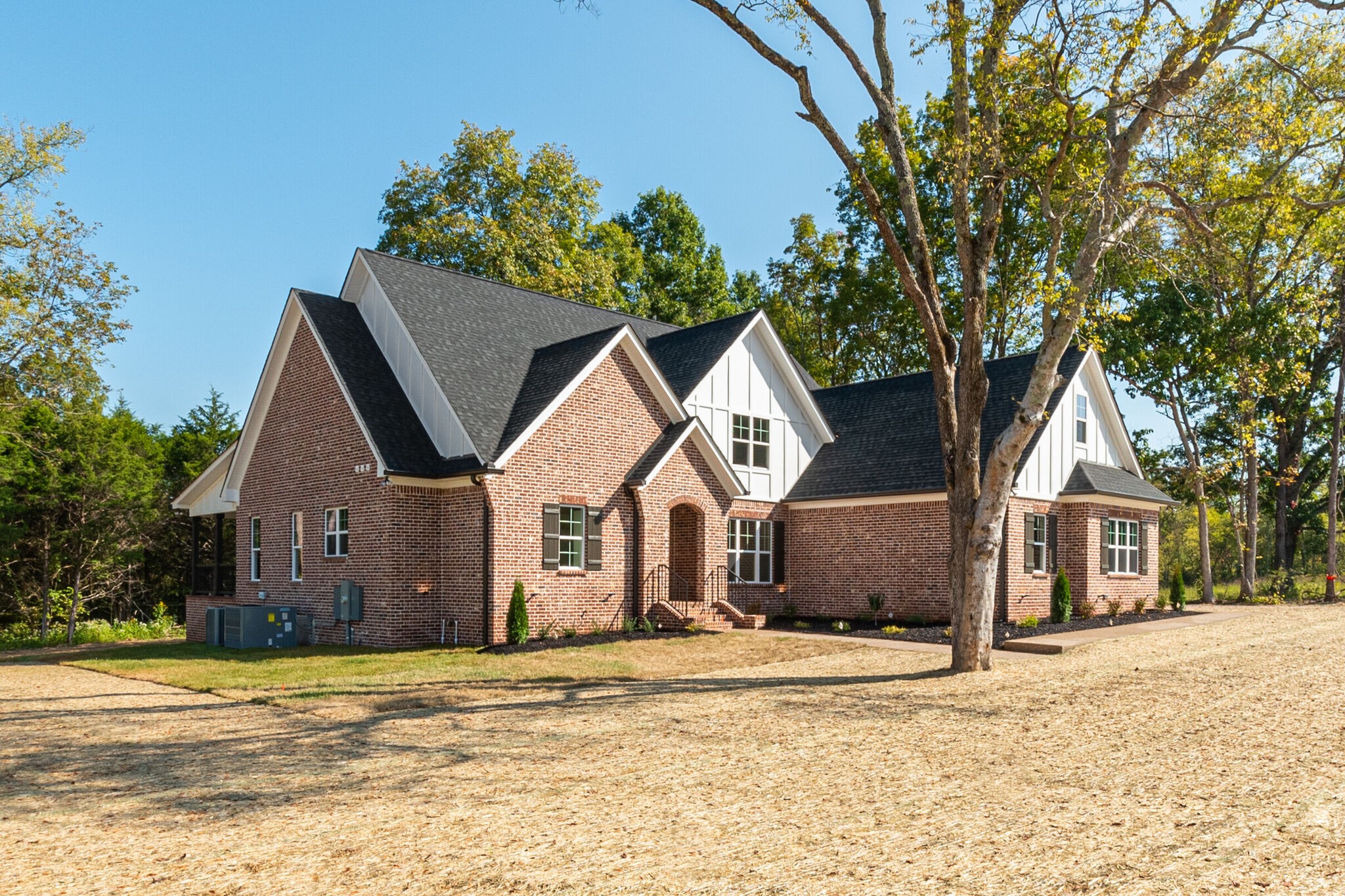 1497 Phillips Road Lebanon, TN 37087 - Photo 2 of 43 a view of a house with a yard and large trees