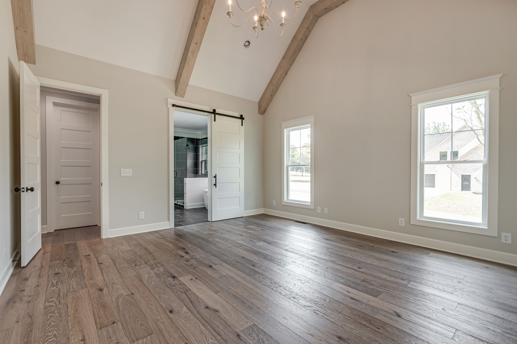 1497 Phillips Road Lebanon, TN 37087 - Photo 24 of 43 an empty room with wooden floor and windows