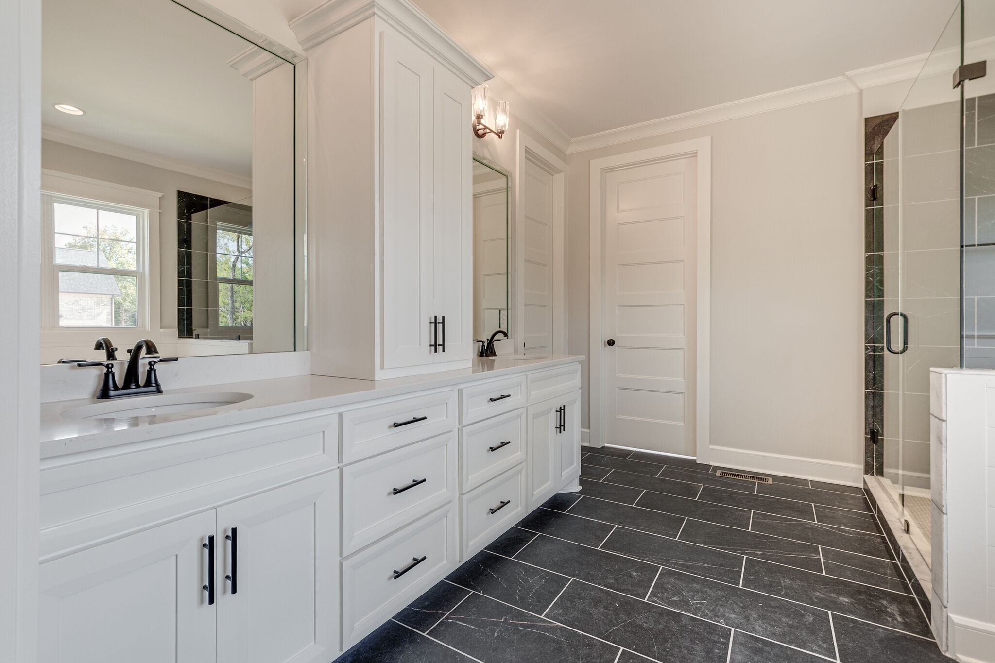 1497 Phillips Road Lebanon, TN 37087 - Photo 25 of 43 a spacious bathroom with a double vanity sink a mirror and a shower