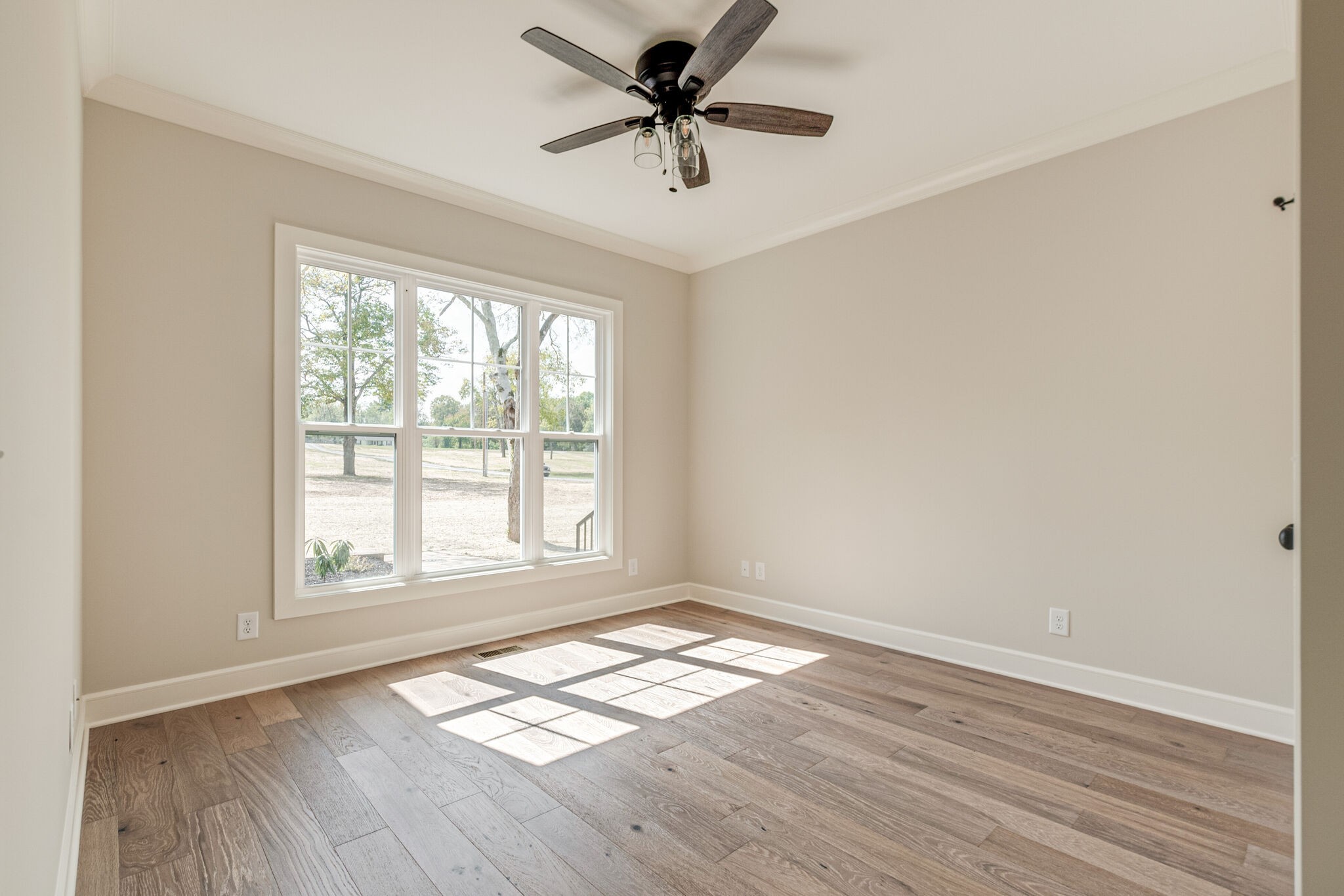 1497 Phillips Road Lebanon, TN 37087 - Photo 30 of 43 wooden floor in an empty room with a window