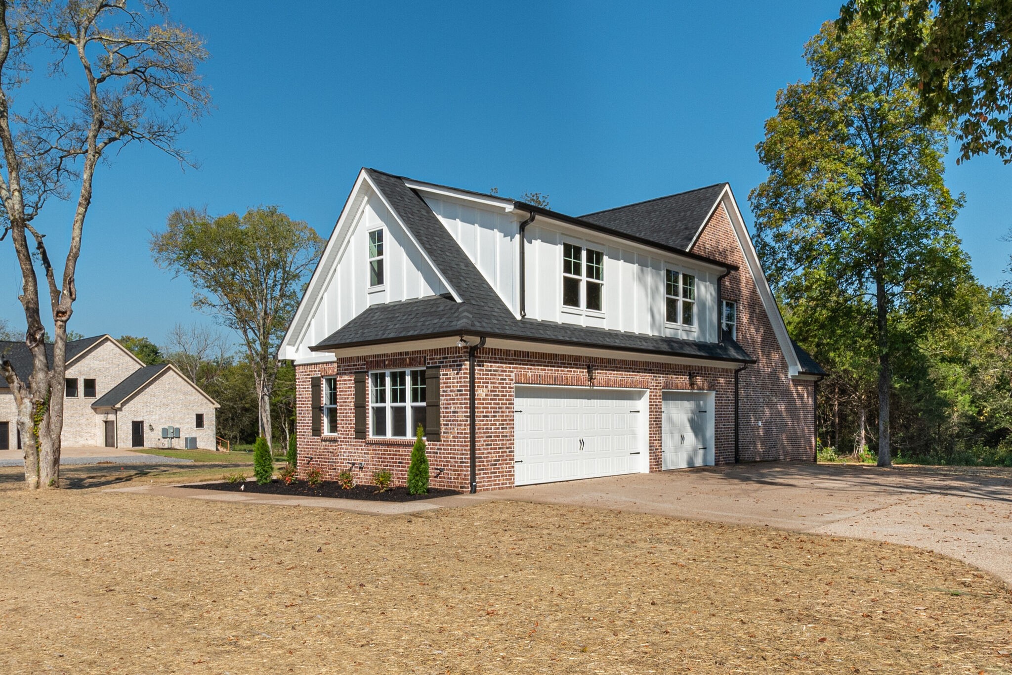 1497 Phillips Road Lebanon, TN 37087 - Photo 3 of 43 a front view of a house with a yard and garage