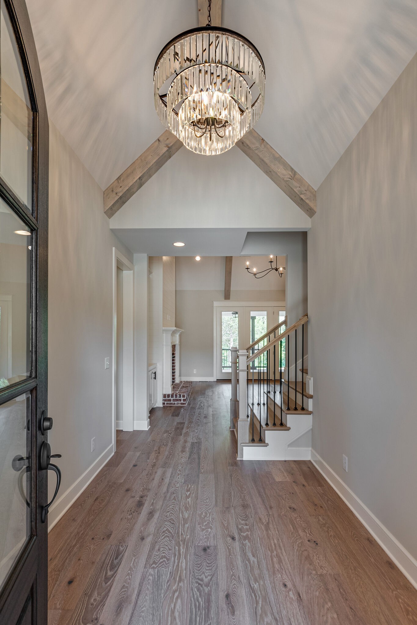 1497 Phillips Road Lebanon, TN 37087 - Photo 4 of 43 a view of a hallway with wooden floor and chandelier