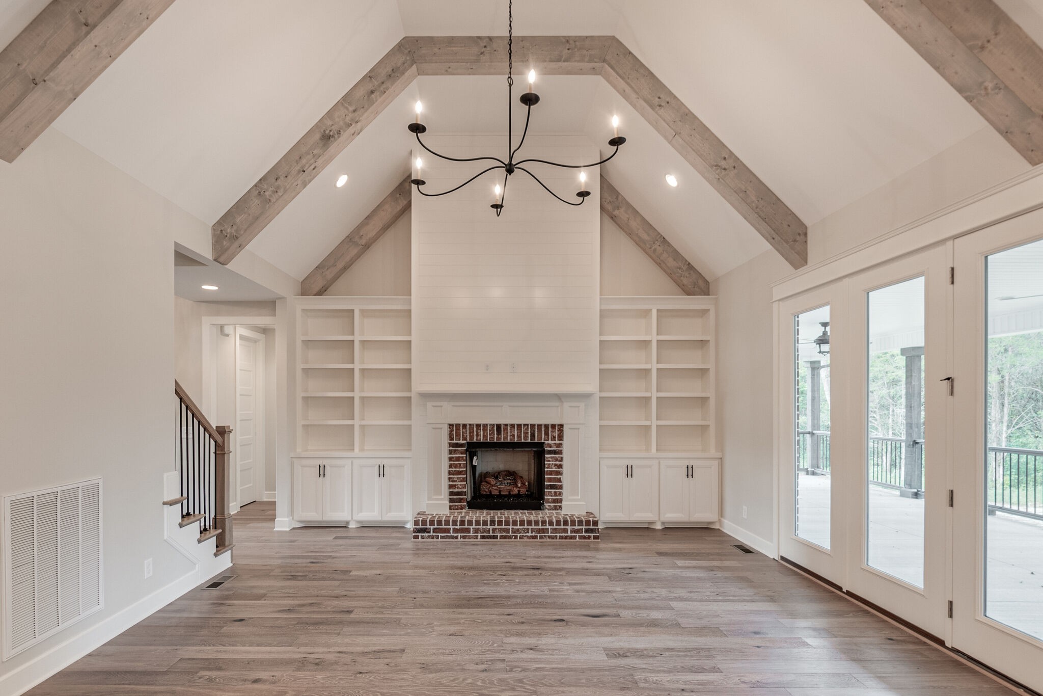 1497 Phillips Road Lebanon, TN 37087 - Photo 9 of 43 a view of a livingroom with a fireplace a ceiling fan and wooden floor