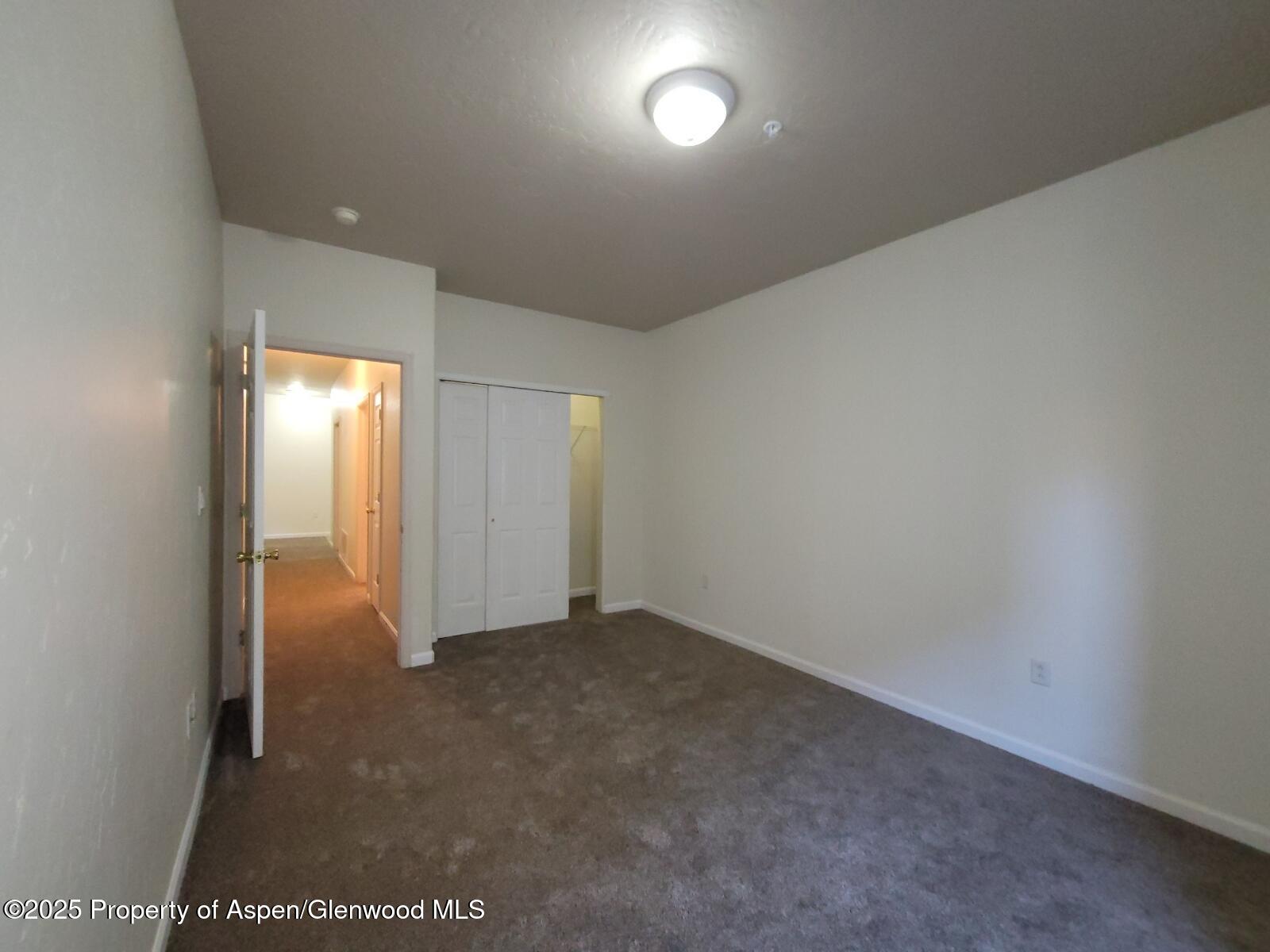 2701 Midland Avenue, Unit 511 Glenwood Springs, CO 81601 - Photo 13 of 21 an empty room with windows