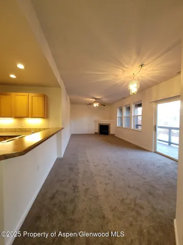 a view of an empty room with a window