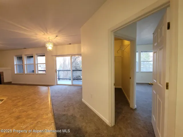 a view of livingroom with hardwood floor and a ceiling fan