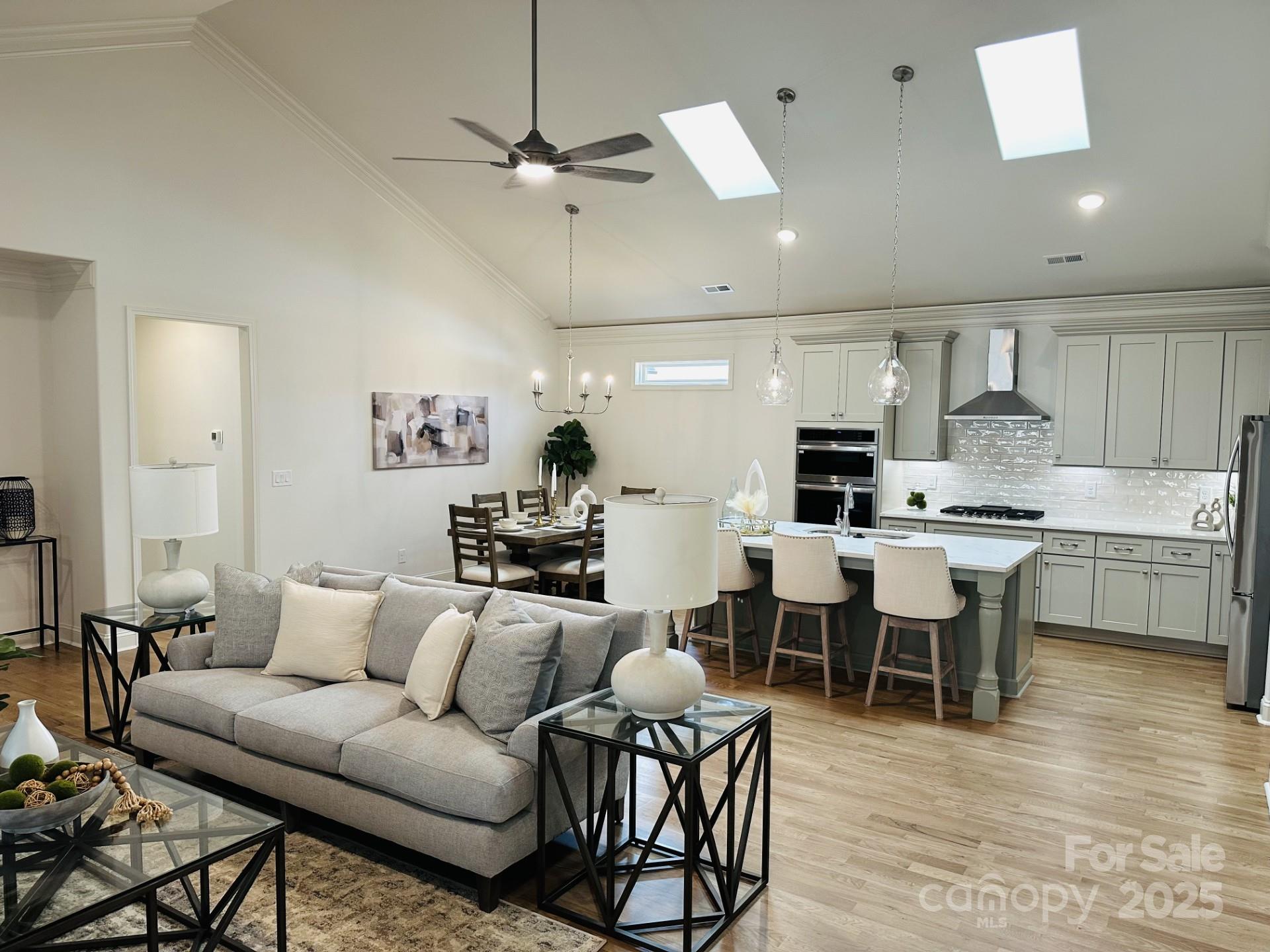 92 Silver Trce Lane Denver, NC 28037 - Photo 2 of 10 a living room with furniture a dining table and kitchen view