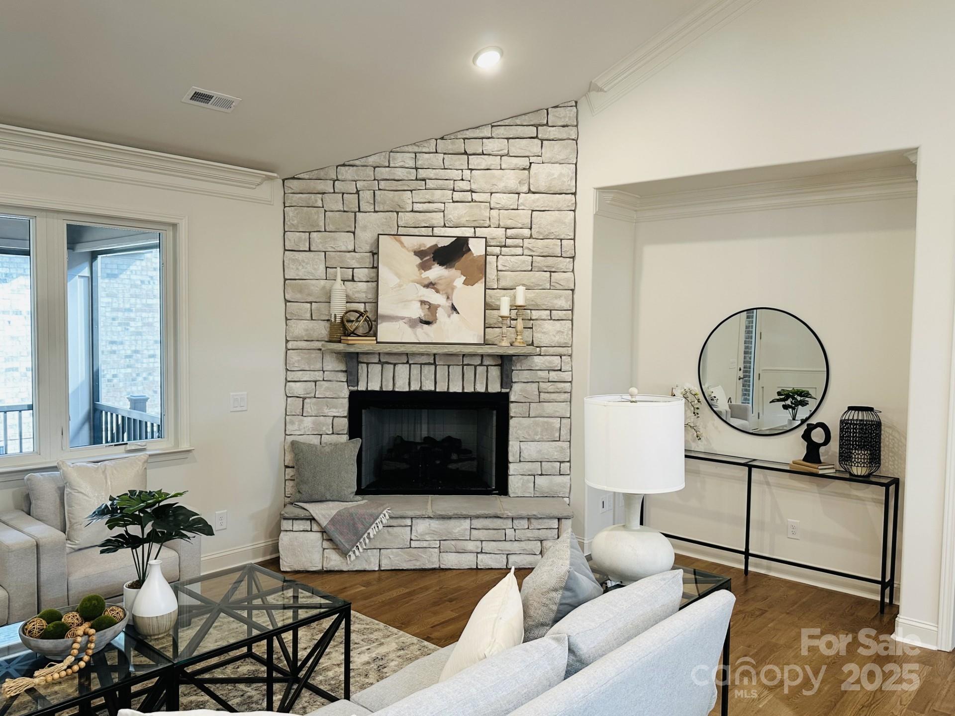92 Silver Trce Lane Denver, NC 28037 - Photo 4 of 10 a living room with furniture a flat screen tv and a fireplace