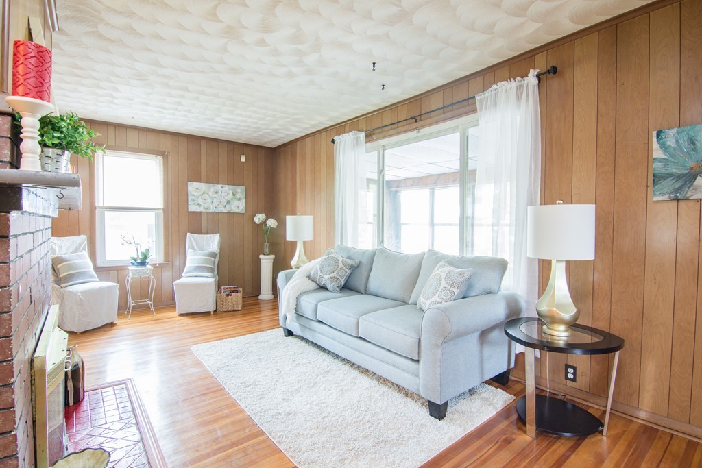 55 Crown Street Springfield, MA 01108 - Photo 23 of 30 a living room with furniture and a large window