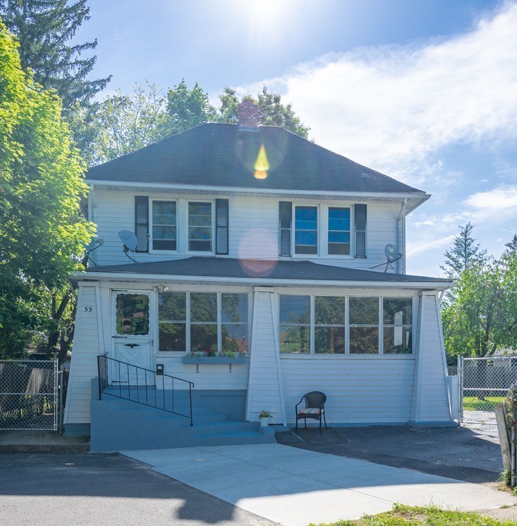 55 Crown Street Springfield, MA 01108 - Photo 3 of 30 a front view of a house with a yard