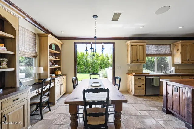 a dining room with furniture and a window