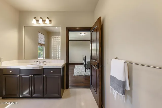 a bathroom with a bathtub and a sink