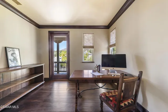 a bathroom with a granite countertop toilet sink and mirror