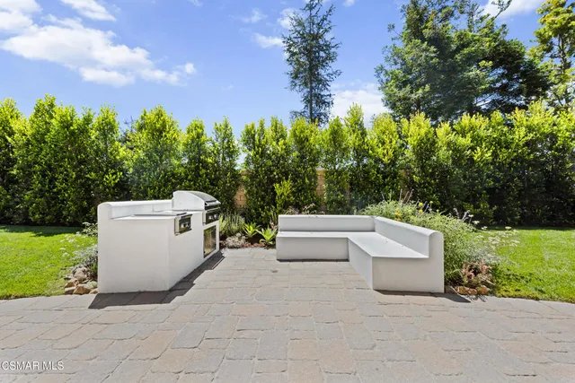 a potted plant sitting in front of a house